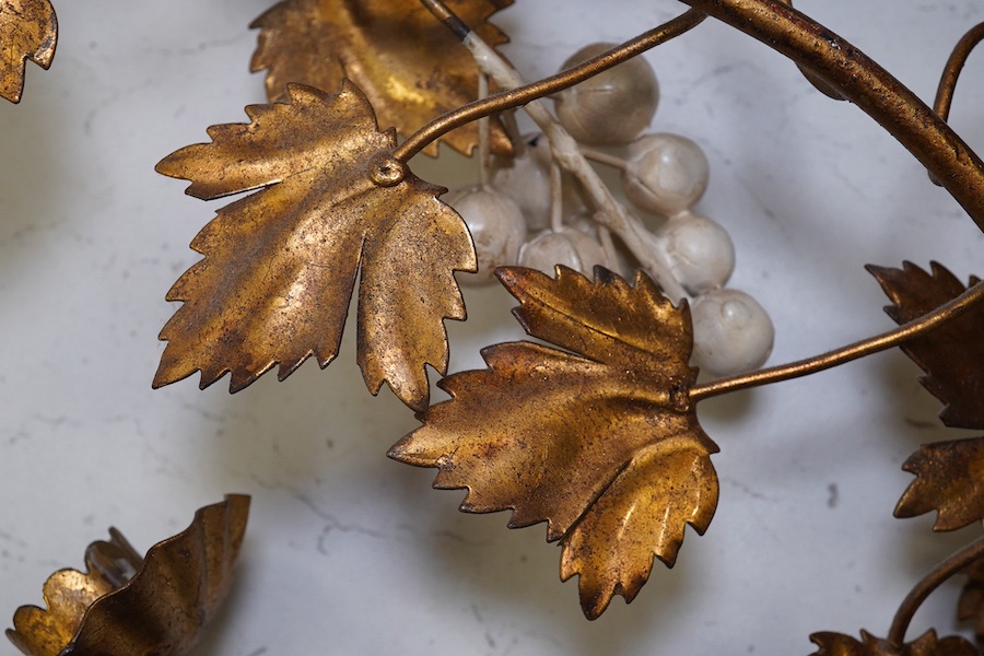 A pair of gilt metal and porcelain ‘white berry’ two branch wall sconces, 55.5cm. Condition - fair to good